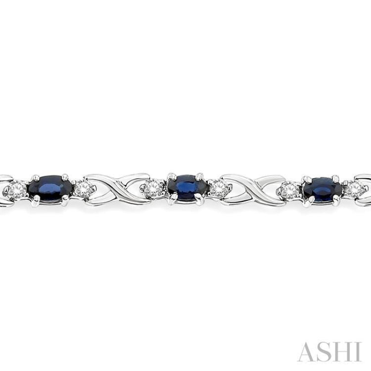 5x3 MM Oval Cut Sapphire and 1/10 Ctw Single Cut Diamond Bracelet in 10K White Gold