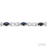 5x3 MM Oval Cut Sapphire and 1/10 Ctw Single Cut Diamond Bracelet in 10K White Gold