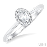 5x3 MM Oval Shape White Topaz and 1/20 Ctw Single Cut Diamond Halo Semi-Precious Ring in 10K White Gold