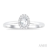 5x3 MM Oval Shape White Topaz and 1/20 Ctw Single Cut Diamond Halo Semi-Precious Ring in 14K White Gold